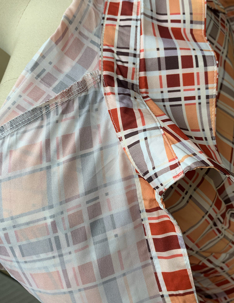 Macacão feminino estampado xadrez de mangas longas. - O Retalho