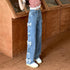 Calça Jeans Reta Solta com Laço na Cintura Alta - O Retalho